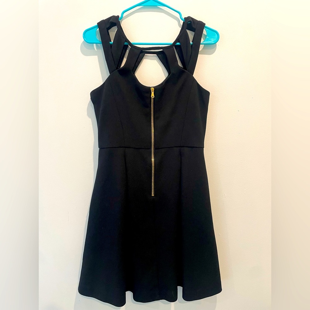 Size medium Betsey Johnson perfect black dress with cut out details on the chest